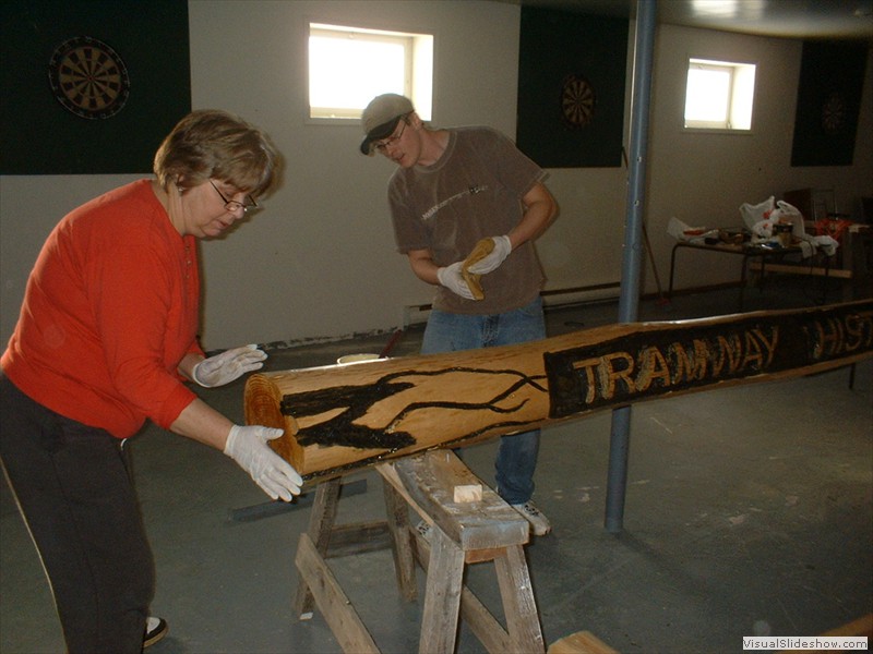 Marge and worker from Sops Arm carving Tramway Sign Header